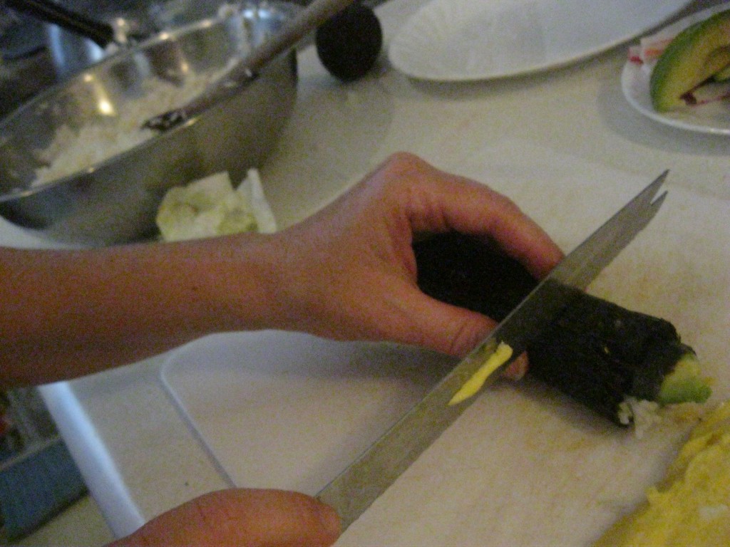 Cutting the sushi rolls